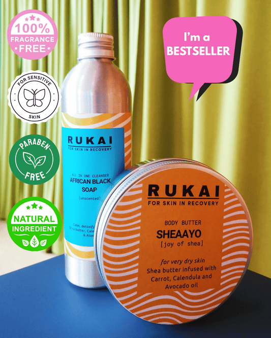 Rukai African Black Soap and Sheaayo Body Butter for eczema relief on a blue surface with green curtain background